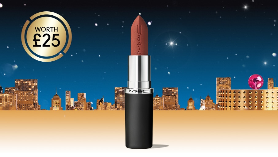 macximal silky matte lipstick in taupe on a cityscape background