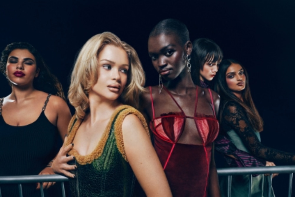 A row of women wearing MAC cosmetics